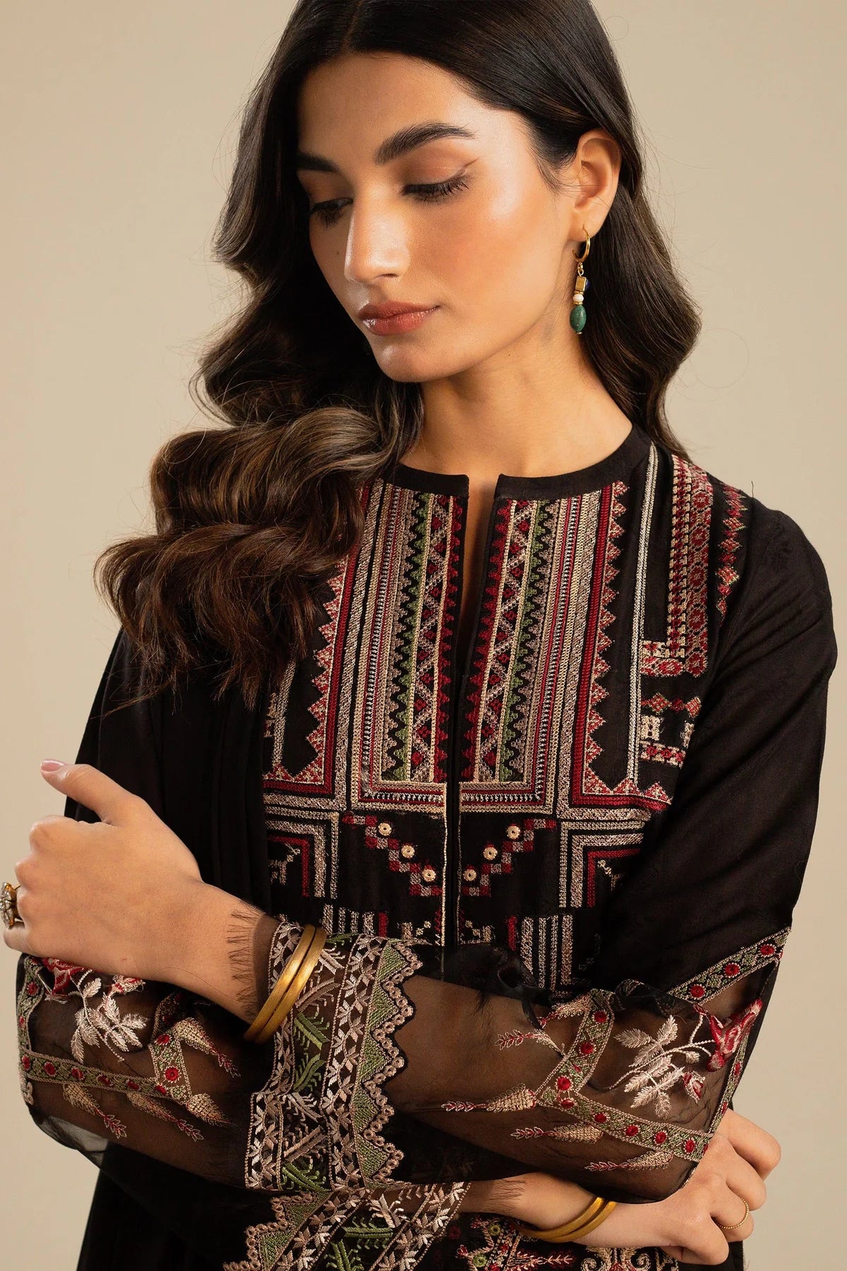 This long black kameez displays a beautiful fusion between traditional and modern cross-stitch embroidery By Zara Shahjahan