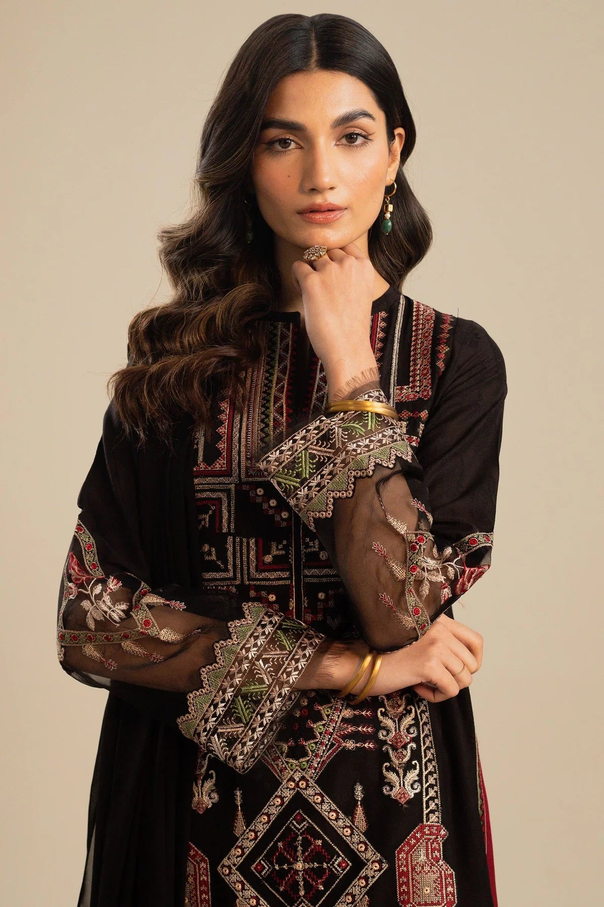 This long black kameez displays a beautiful fusion between traditional and modern cross-stitch embroidery By Zara Shahjahan