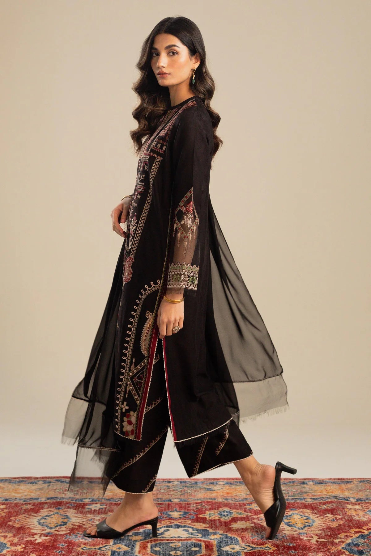 This long black kameez displays a beautiful fusion between traditional and modern cross-stitch embroidery By Zara Shahjahan