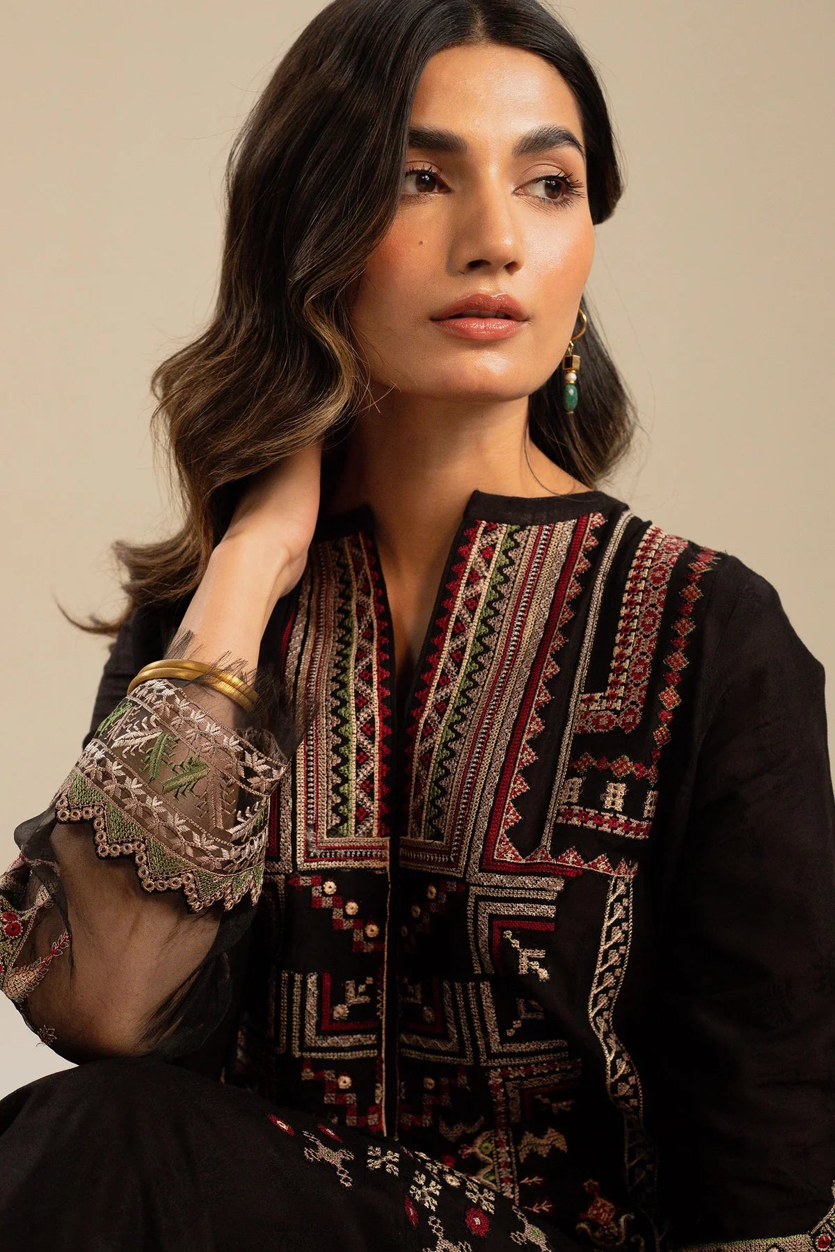 This long black kameez displays a beautiful fusion between traditional and modern cross-stitch embroidery By Zara Shahjahan