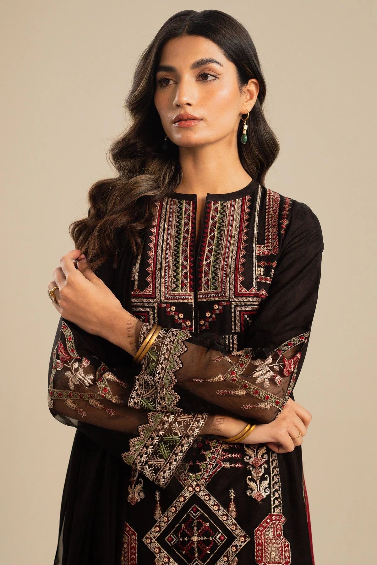 This long black kameez displays a beautiful fusion between traditional and modern cross-stitch embroidery By Zara Shahjahan