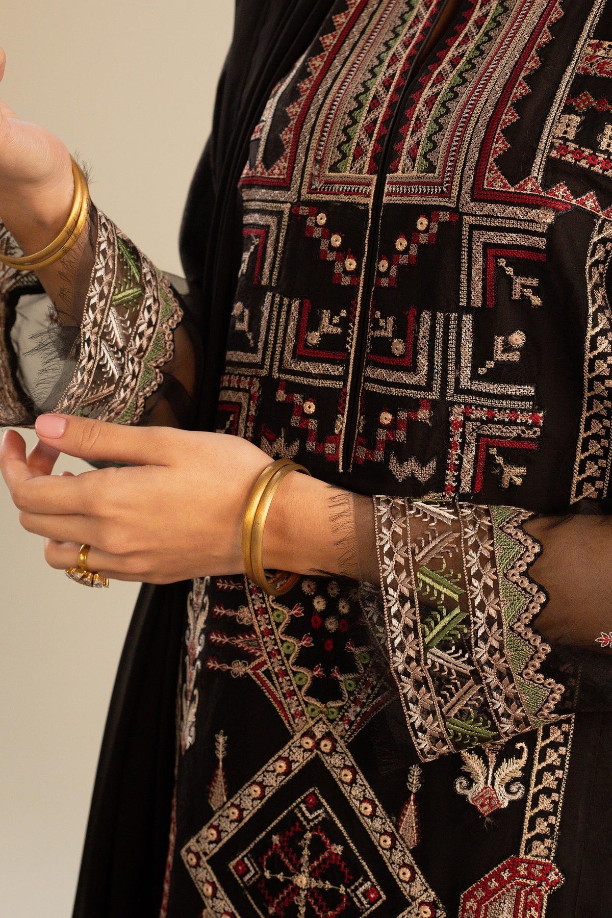 This long black kameez displays a beautiful fusion between traditional and modern cross-stitch embroidery By Zara Shahjahan