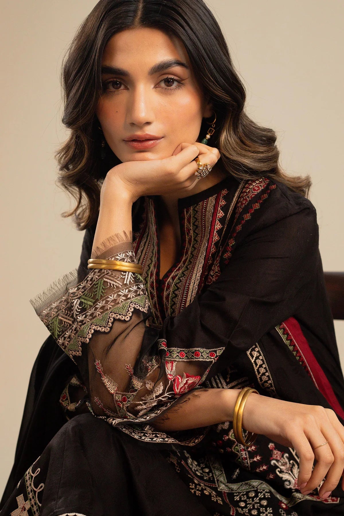 This long black kameez displays a beautiful fusion between traditional and modern cross-stitch embroidery By Zara Shahjahan