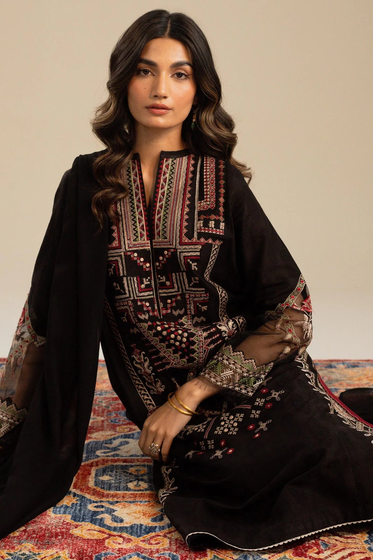 This long black kameez displays a beautiful fusion between traditional and modern cross-stitch embroidery By Zara Shahjahan