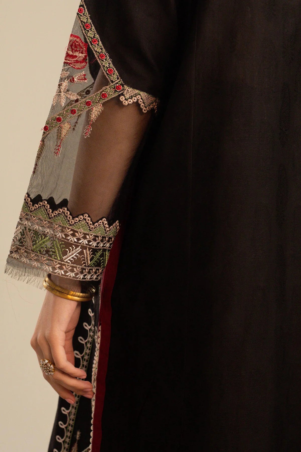 This long black kameez displays a beautiful fusion between traditional and modern cross-stitch embroidery By Zara Shahjahan